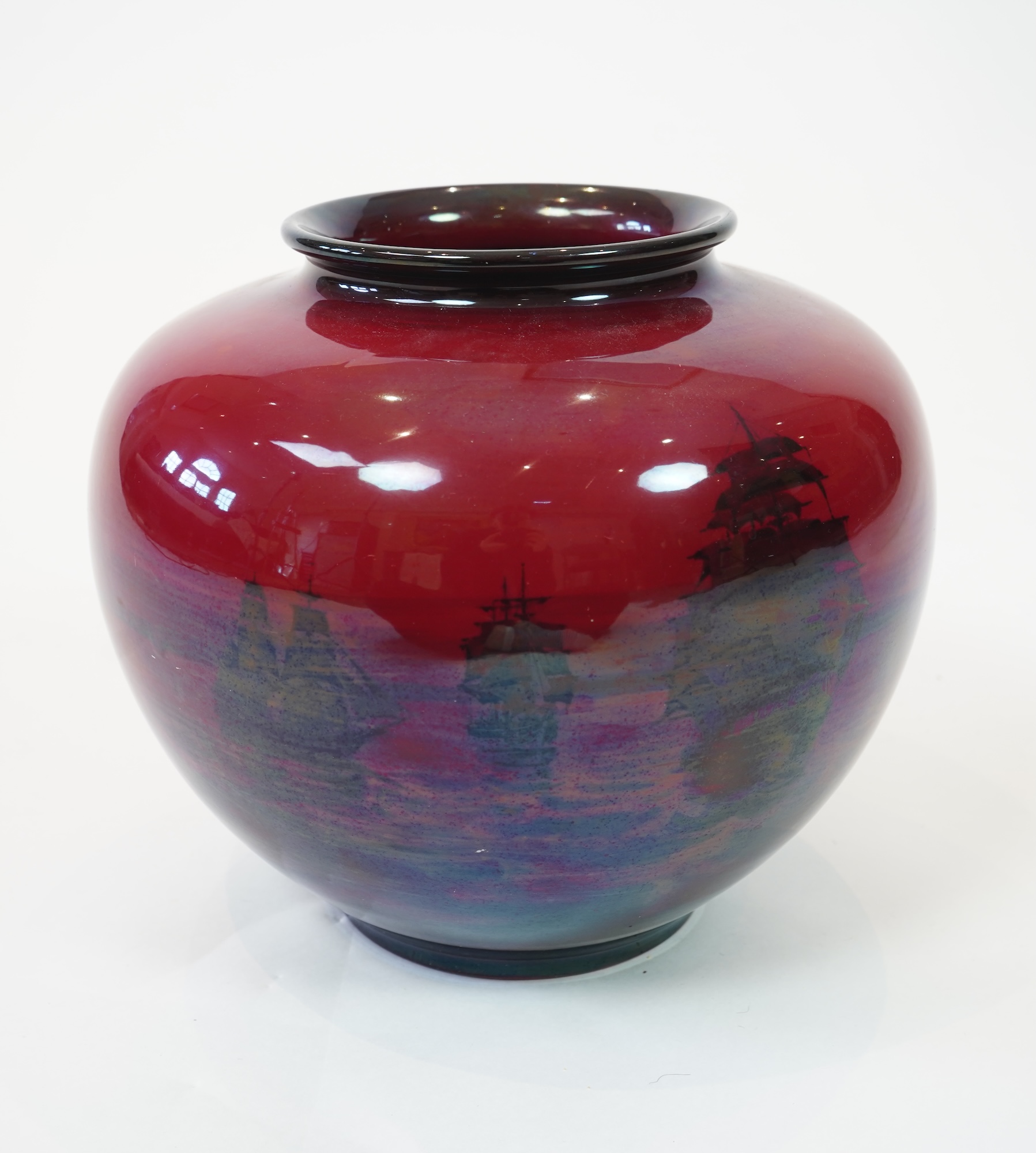 A large Doulton flambe vase decorated with ships, 29cm high